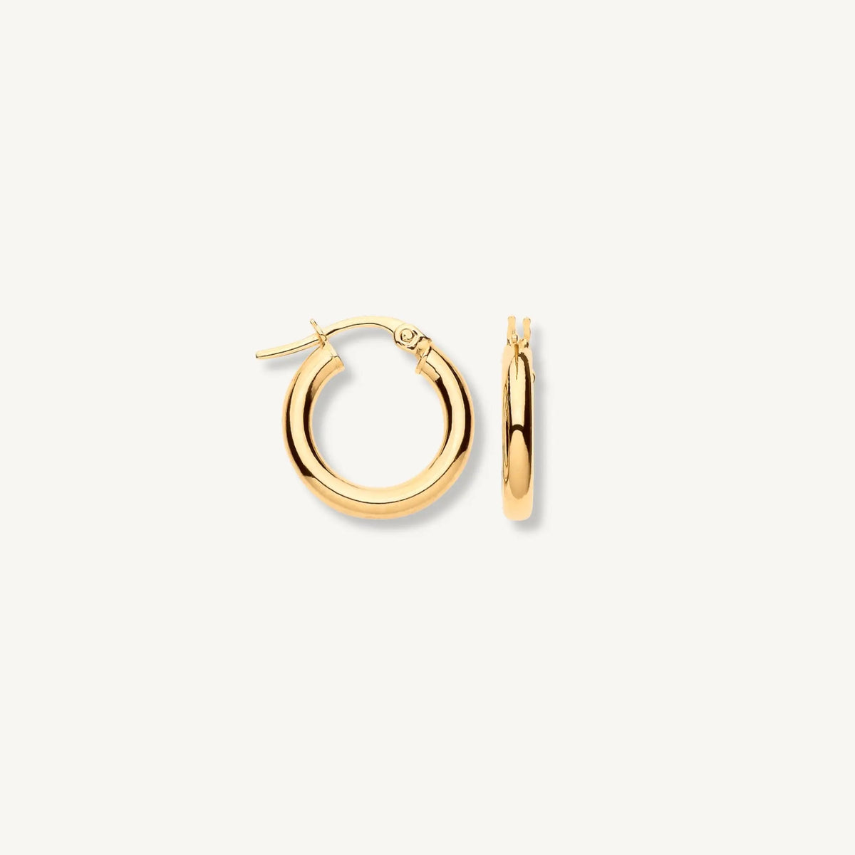 Gold hoop earrings on a white background