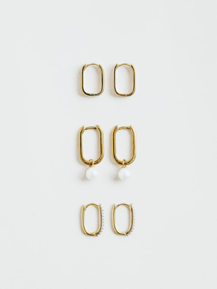 Bold rectangle huggie hoop earrings in 9ct gold, worn