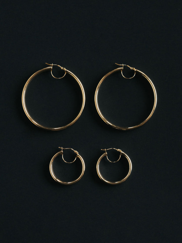 9ct yellow gold court tube hoops, worn