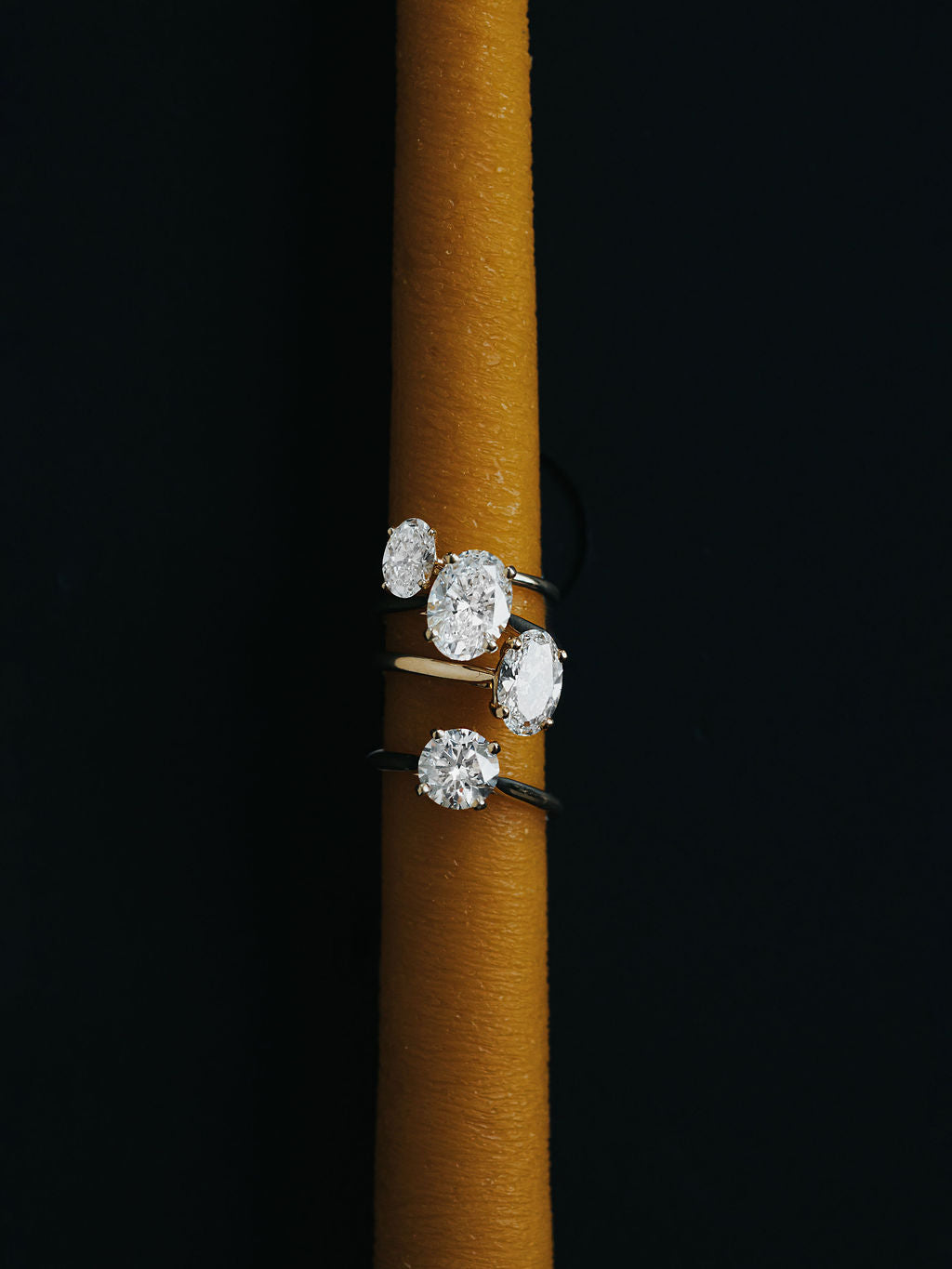 9ct yellow gold engagement ring with 2ct oval diamond, worn