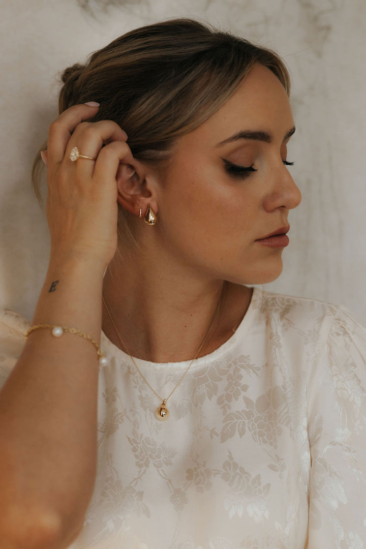 9ct yellow gold teardrop studs, close up