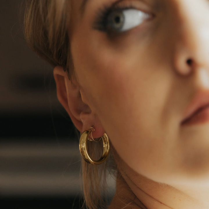 Court tube hoop earrings 25mm in 9ct yellow gold