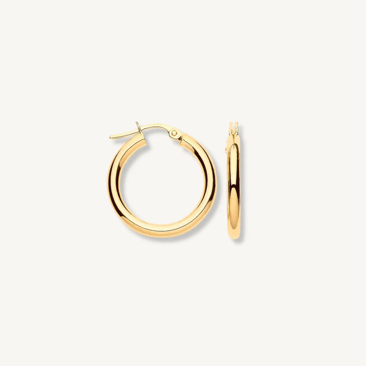 Solid 9ct yellow gold 20mm tube hoop earrings on white background