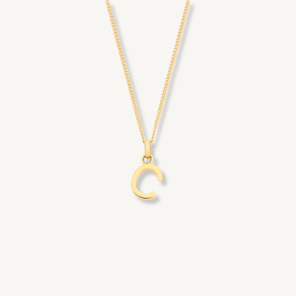 Solid 9ct gold initial necklace worn against neck