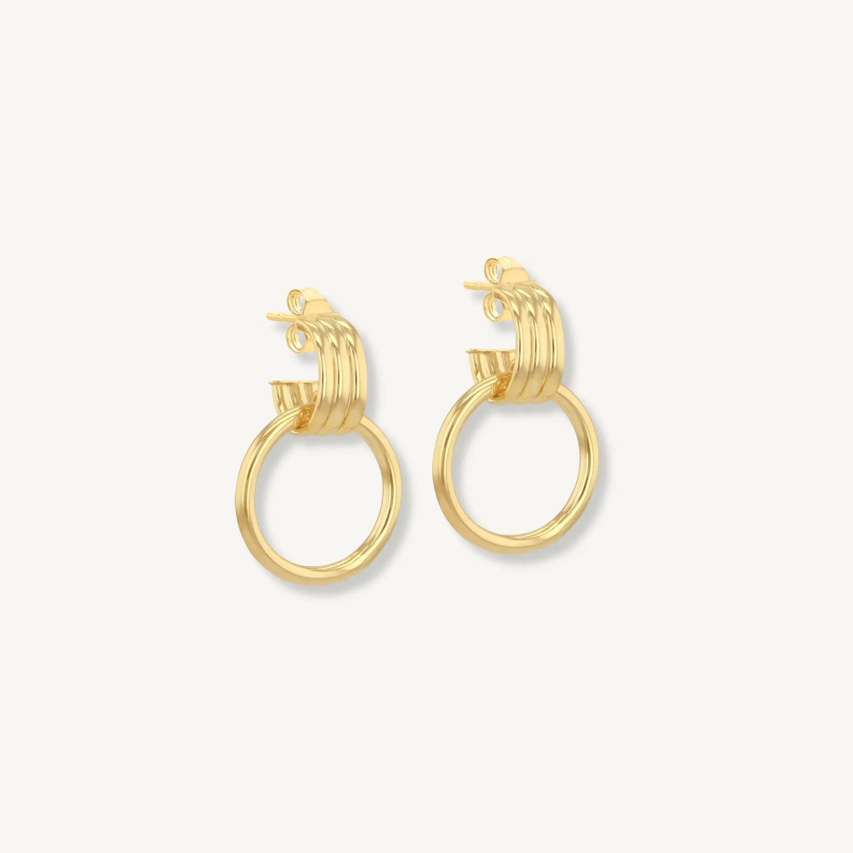 Gold hoop earrings on a white background