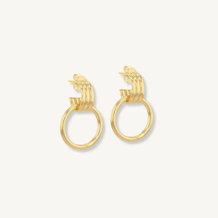 Gold hoop earrings on a white background