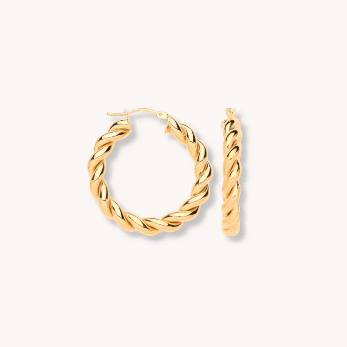 Pair of gold hoop earrings on a white background