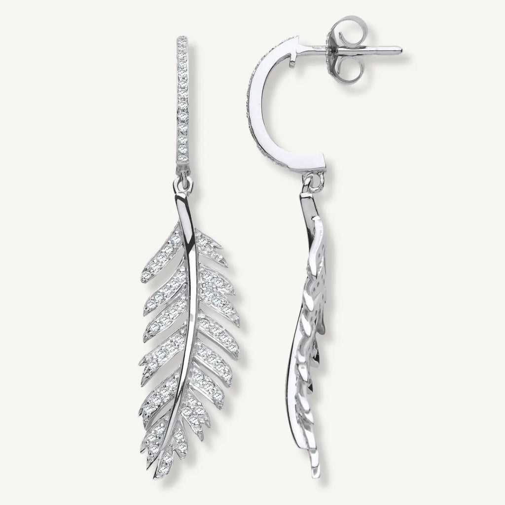 Silver feather-shaped earrings on a white background