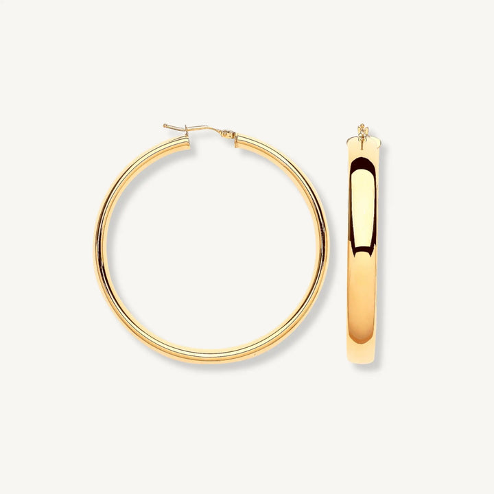 Gold hoop earrings on a white background